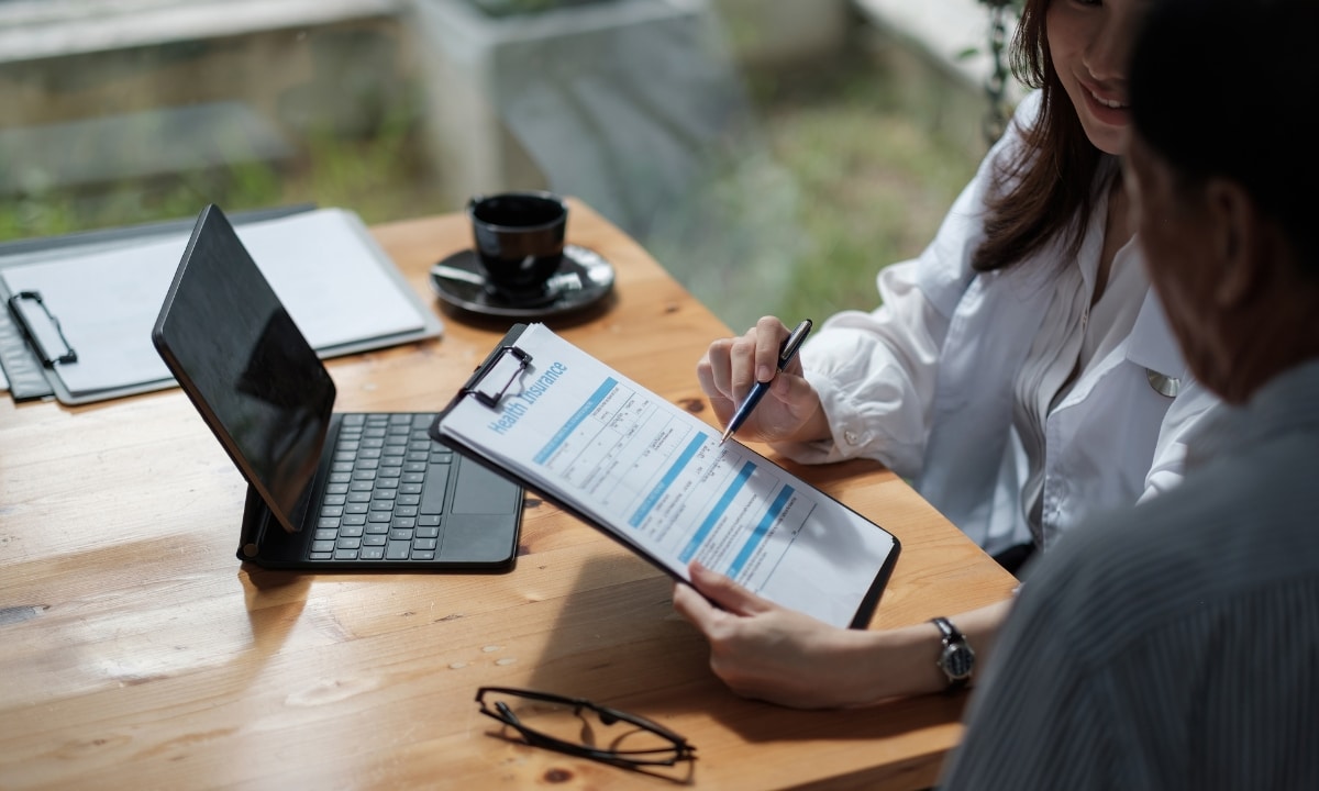 woman explaining Group Health Insurance