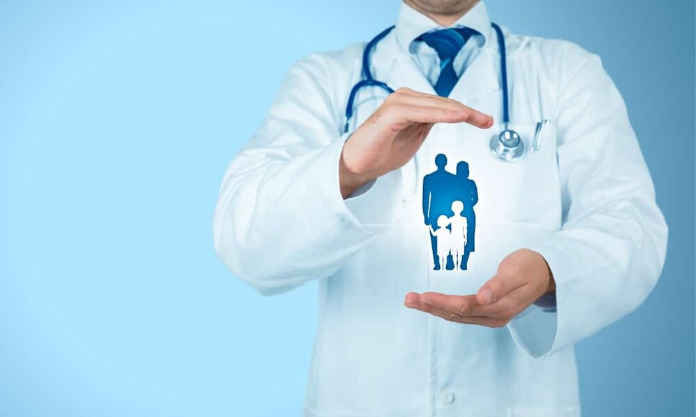 a man in a doctor's coat holding his hands out with a silhouette of a family floating between them