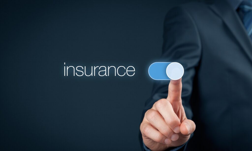 a person's pointer finger on a slider which has the word "insurance" next to it