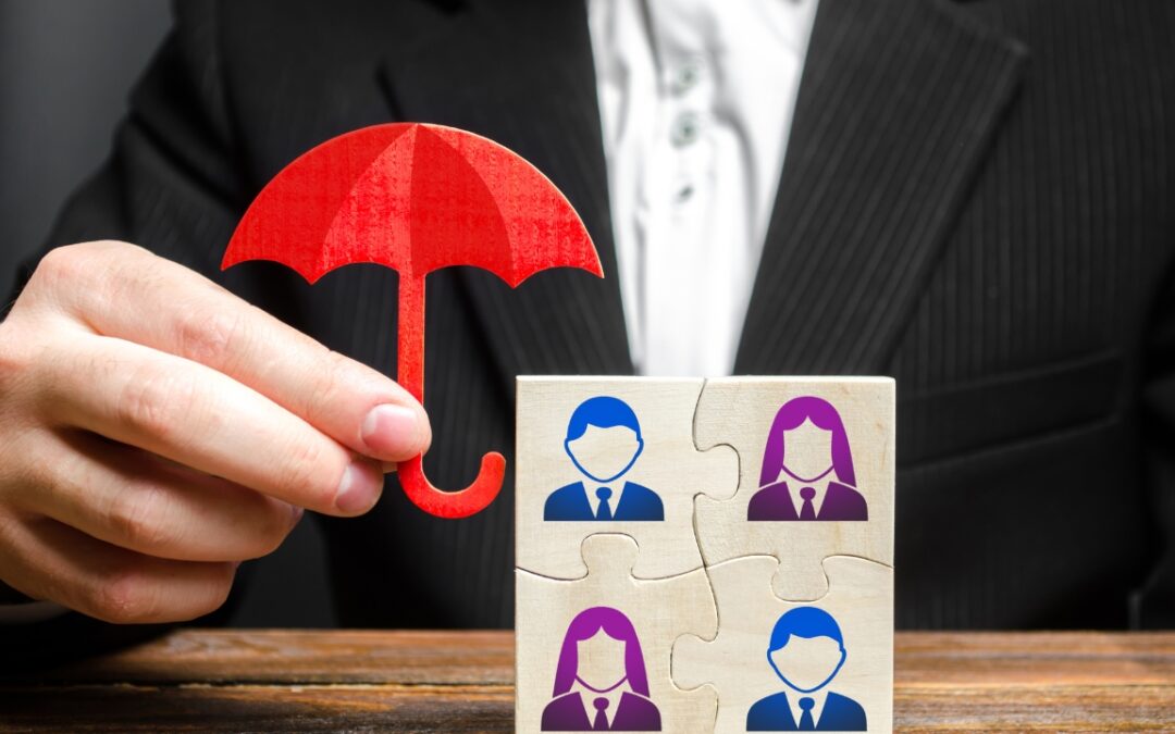 a person holding a tiny umbrella over tiny figures on a puzzle square to imply protecting or shielding employees will raise employee satisfaction rates