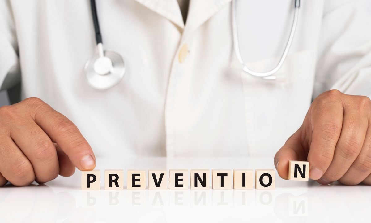 a doctor spelling out "prevention" with wooden blocks