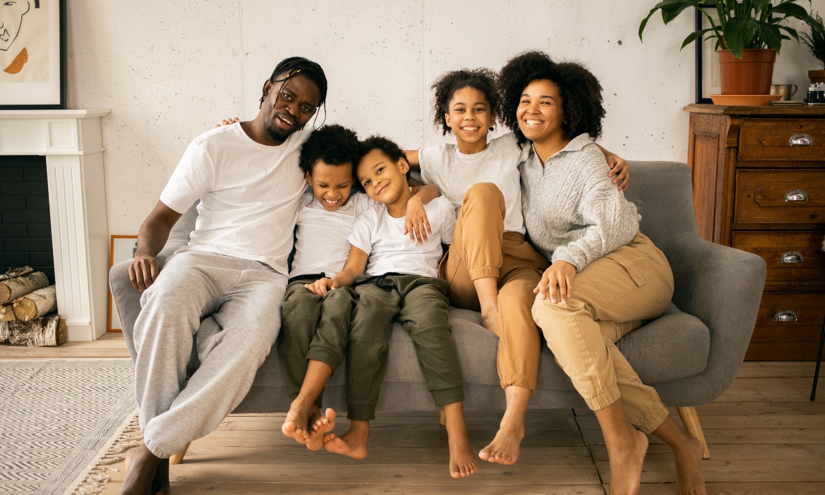 a family piled up on a couch