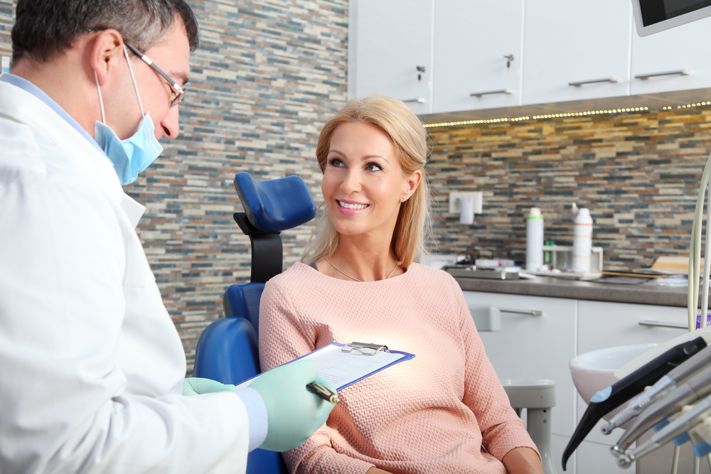 woman with dental insurance policy
